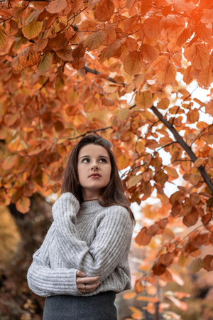 Beautiful young girl enjoying the nature. Gorgeous girl in the nature.の写真素材
