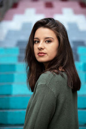 Beautiful young girl surrounded with a colorful background. Gorgeous woman.の写真素材