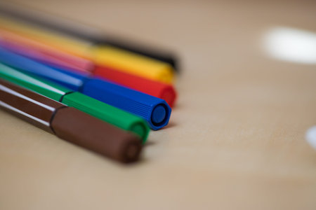 Colorful school equipments on a wooden background. Colorful watercolor.