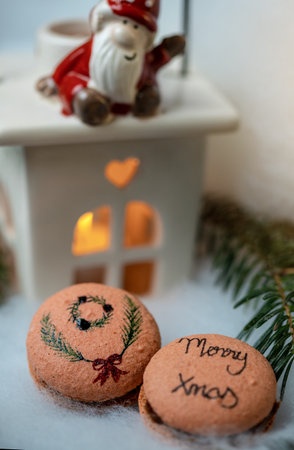 Christmas macarons on a cozy and warm background. Christmas time.の写真素材