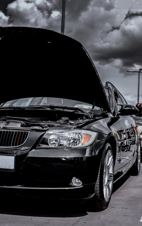 Close up of a headlight. Headight of a black car.の写真素材