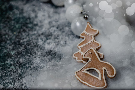 Christmas background. Gingerbread on a christmas background,surrounded with white globes.の写真素材
