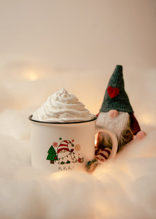 Hot chocolates surrounded with christmas decorations. Sweet hot chocolates with whipped cream. Christmas concept.の写真素材
