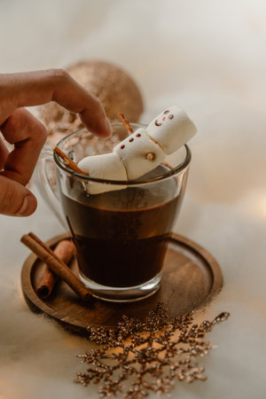 Hot chocolates surrounded with christmas decorations. Sweet hot chocolates with whipped cream. Christmas concept.の写真素材