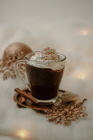 Hot chocolates surrounded with christmas decorations. Sweet hot chocolates with whipped cream. Christmas concept.の写真素材