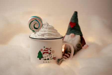 Hot chocolates surrounded with christmas decorations. Sweet hot chocolates with whipped cream. Christmas concept.の写真素材