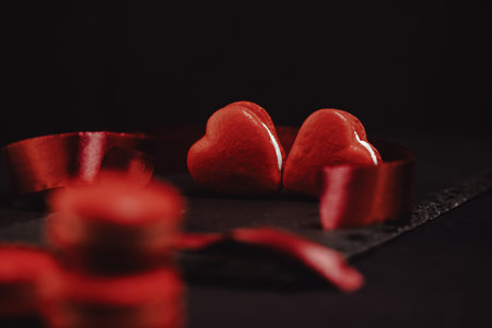 Red macarons for Valentine's day. Red macarons on a black background.の写真素材