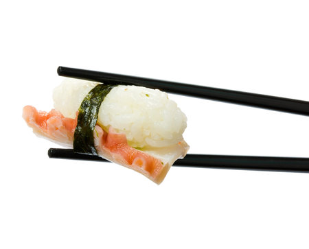 Sushi with chopsticks isolated over white background の写真素材