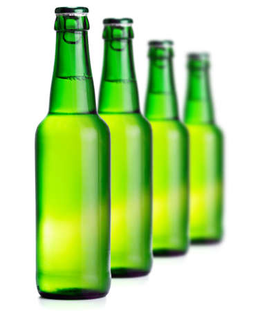 Green beer bottles on the white backgroundの写真素材