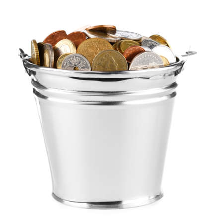 bucket full of coins over whiteの写真素材