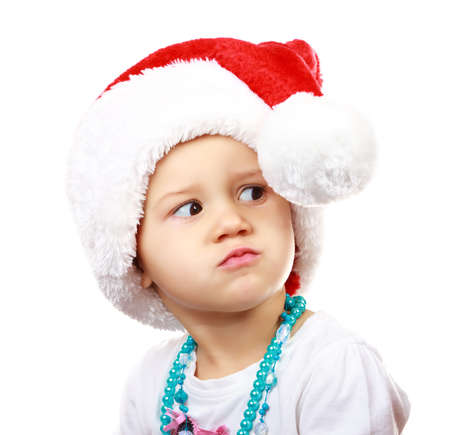 Baby in Santa Claus hat on white background の写真素材