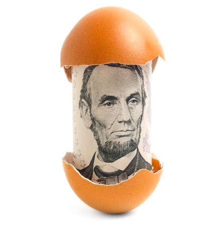 Money in eggshell の写真素材