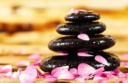 Spa stones with rose petals の写真素材