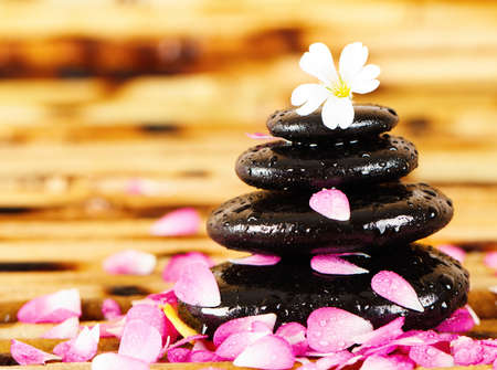 Spa stones with rose petals の写真素材