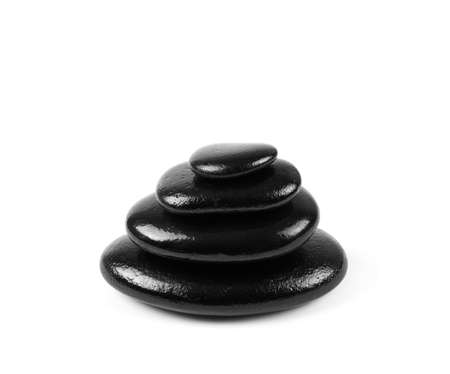 Black stones over white background の写真素材