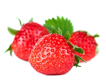 Beautiful ripe red fresh appetizing strawberries with leaves  Isolated on a white background  Studio macroの写真素材