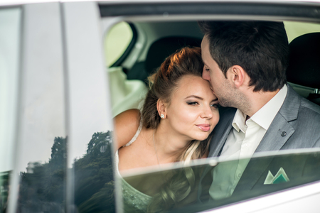 Wedding photo, groom and bride in the carの写真素材