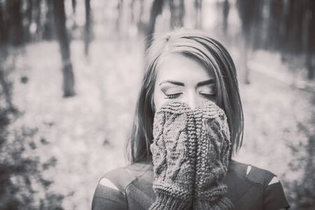 Young pretty girl with forest on backgroundの写真素材