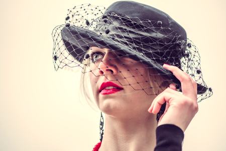 Young pretty sexy lady in black dress outdoor with red lipsの写真素材