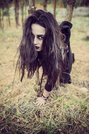Girl with scary face paintingの写真素材