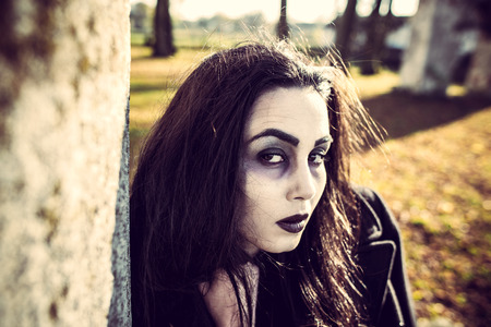 Girl with scary face paintingの写真素材