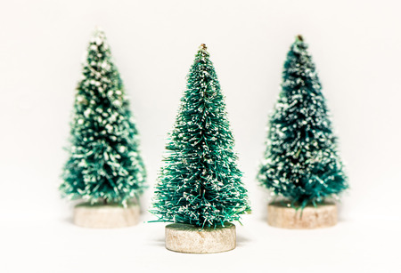 Decorative Christmas trees isolated on whiteの写真素材