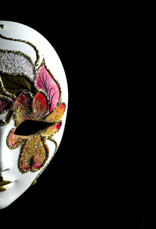 Carnival mask isolated over black backgroundの写真素材