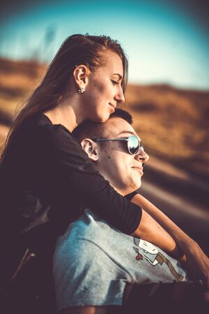 Girlfriend with her boyfriend outdoor in the forestの写真素材