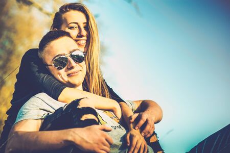 Girlfriend with her boyfriend outdoor in the forestの写真素材
