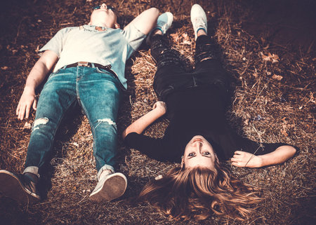 Girlfriend with her boyfriend outdoor in the forestの写真素材