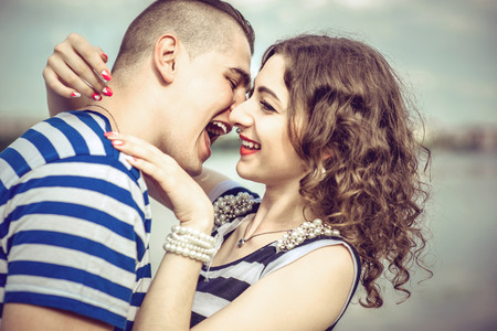 Lovely couple outdoor with lake on backgroundの写真素材