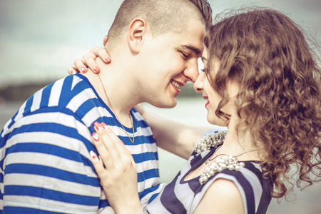 Lovely couple outdoor with lake on backgroundの写真素材