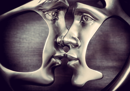 Metal kissing figure of a couple on wooden backgroundの写真素材