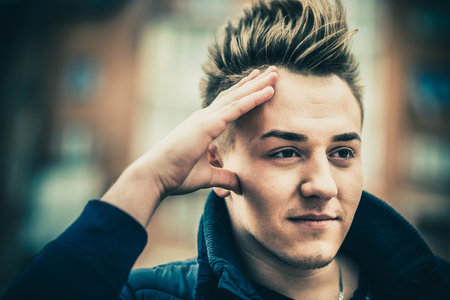 Young men with stylish hair style outdoorの写真素材