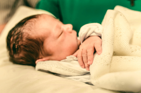 The ceremony of christening the little boy at churchの写真素材