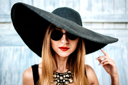 Young pretty sexy girl relaxing outdoor in black swimwearの写真素材