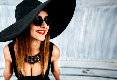 Young pretty sexy girl relaxing outdoor in black swimwearの写真素材