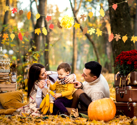 Happy family rest in the park togetherの写真素材