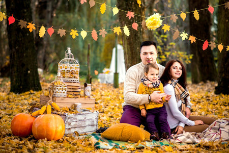 Happy family rest in the park togetherの写真素材
