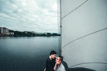 Pretty couple relaxing outdoor on the  yachtの写真素材