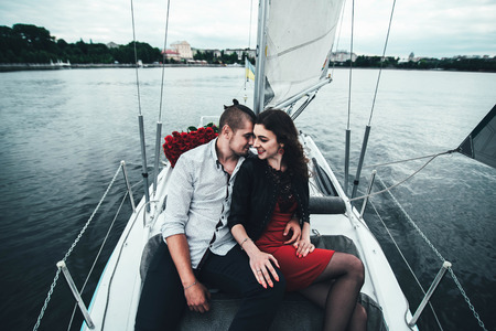 Pretty couple relaxing outdoor on the  yachtの写真素材