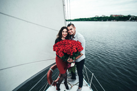 Pretty couple relaxing outdoor on the  yachtの写真素材