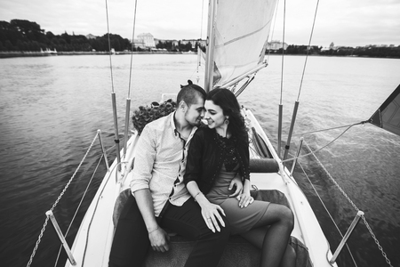 Pretty couple relaxing outdoor on the  yachtの写真素材