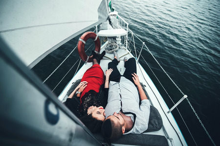 Pretty couple relaxing outdoor on the  yachtの写真素材