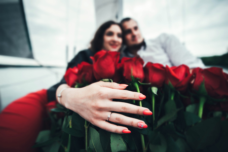 Pretty couple relaxing outdoor on the  yachtの写真素材