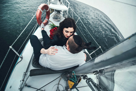 Pretty couple relaxing outdoor on the  yachtの写真素材