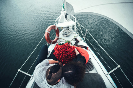 Pretty couple relaxing outdoor on the  yachtの写真素材