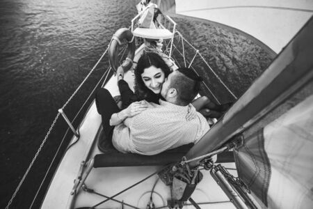 Pretty couple relaxing outdoor on the  yachtの写真素材