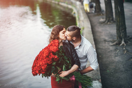 Pretty couple  in the park near lake