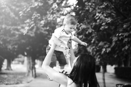 Mother with her little son in the parkの写真素材